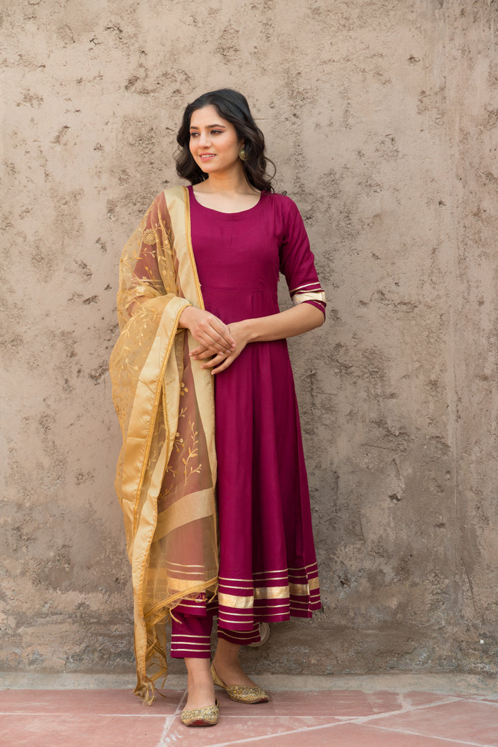 Rosewood Solid Wine Flared Kurta Set Paired With Solid Pant And Brown Net Embroider Dupatta