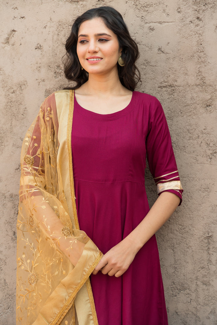 Rosewood Solid Wine Flared Kurta Set Paired With Solid Pant And Brown Net Embroider Dupatta
