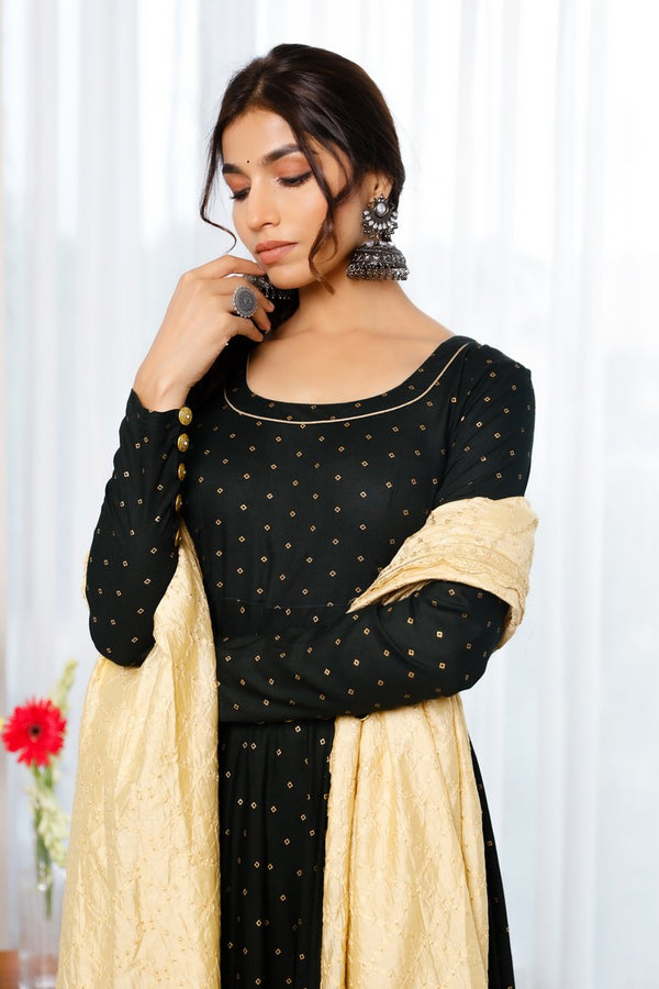 Black Rayon Anarkali With Golden Polka Print Paired Up With Pants And Embroided Golden Tissue Dupatta